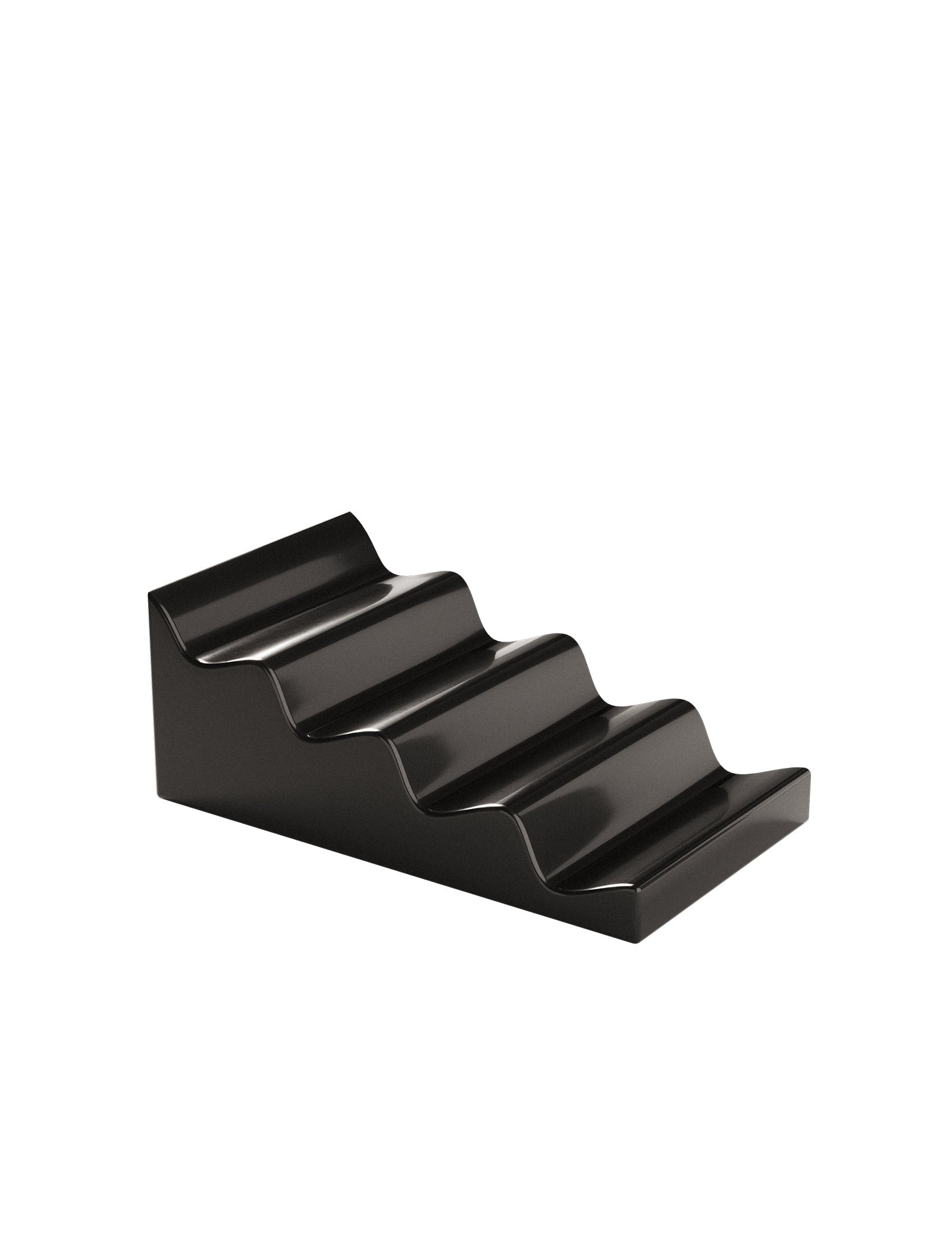 CASCADE Fruit Stand black ceramic organizer with stepped design for holding fruit like apples and pears.