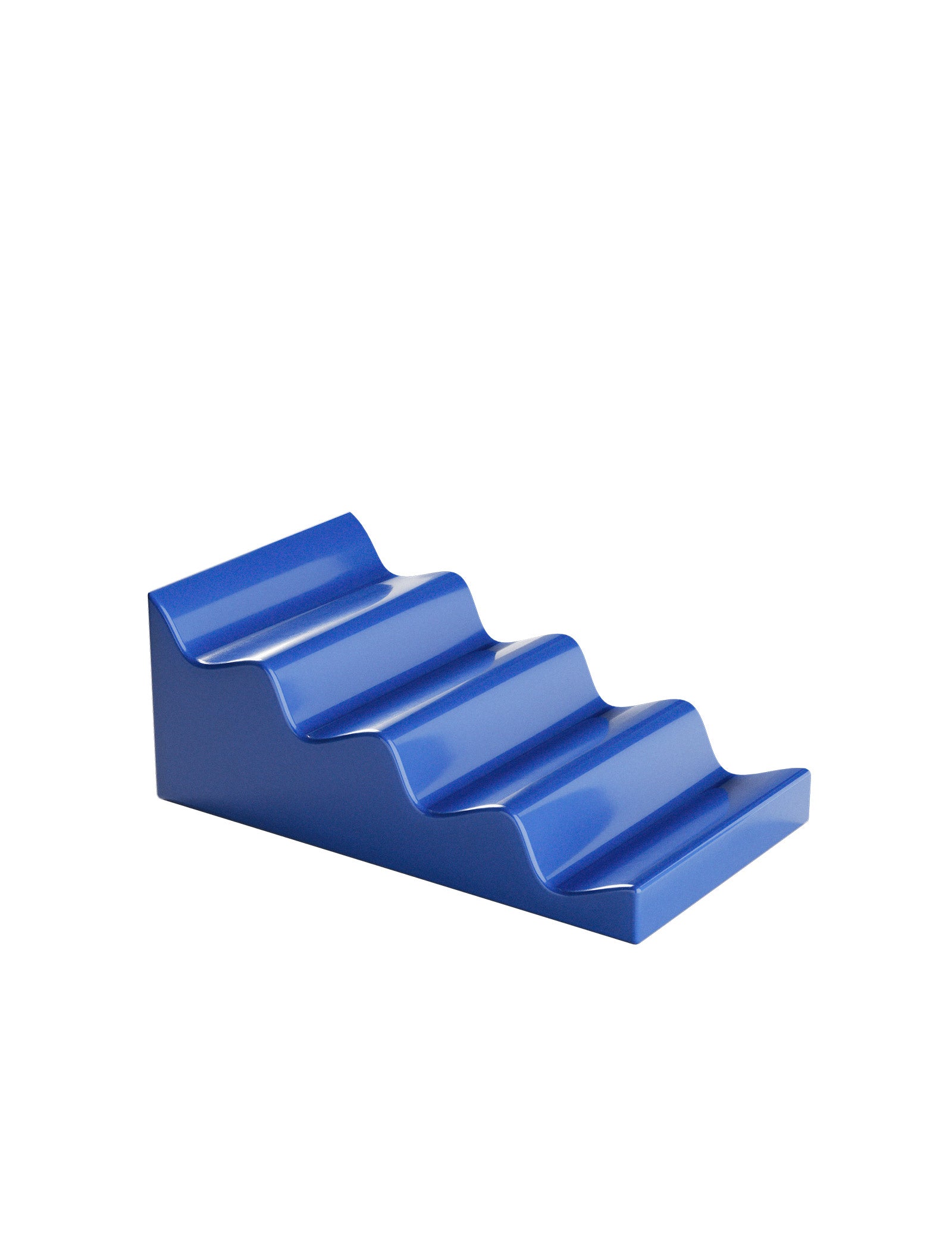 CASCADE Fruit Stand in blue ceramic with wave design for airy, organized fruit display without pressure marks.