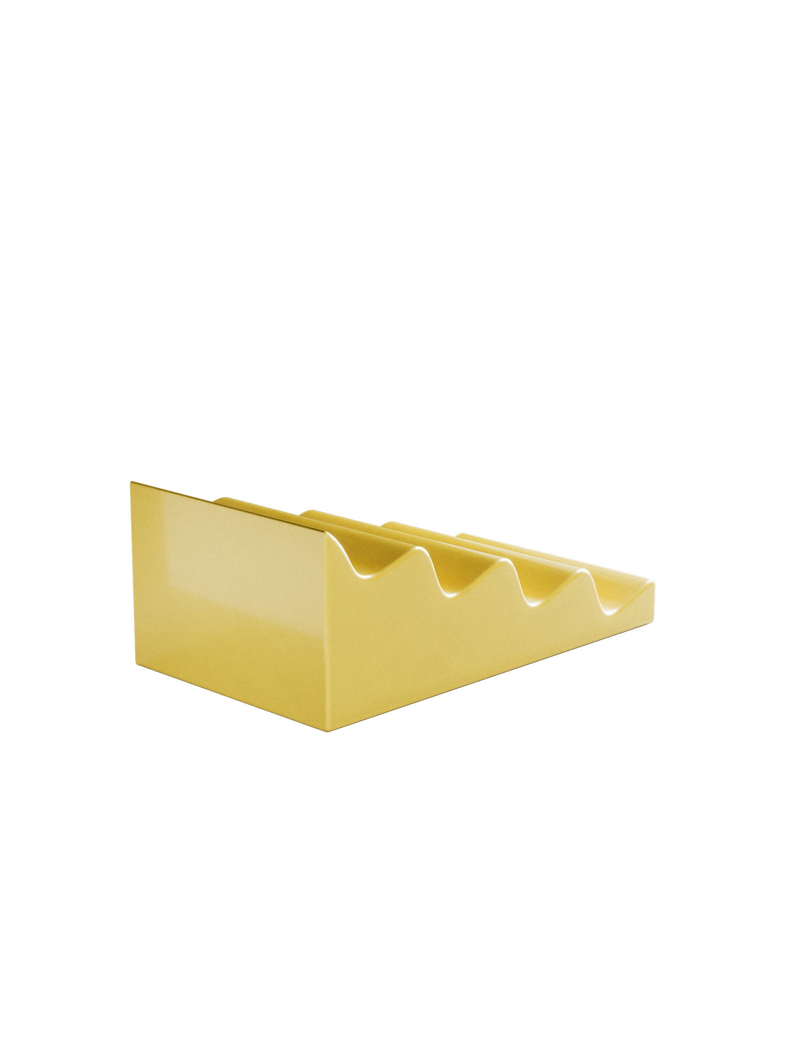 CASCADE Fruit Stand in yellow ceramic with angled wave design to display fruits without pressure or crowding.