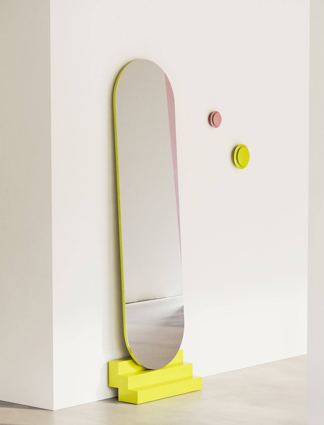 NONCHALANT Mirror L leaning securely against wall with bright yellow stepped base and rounded top design.