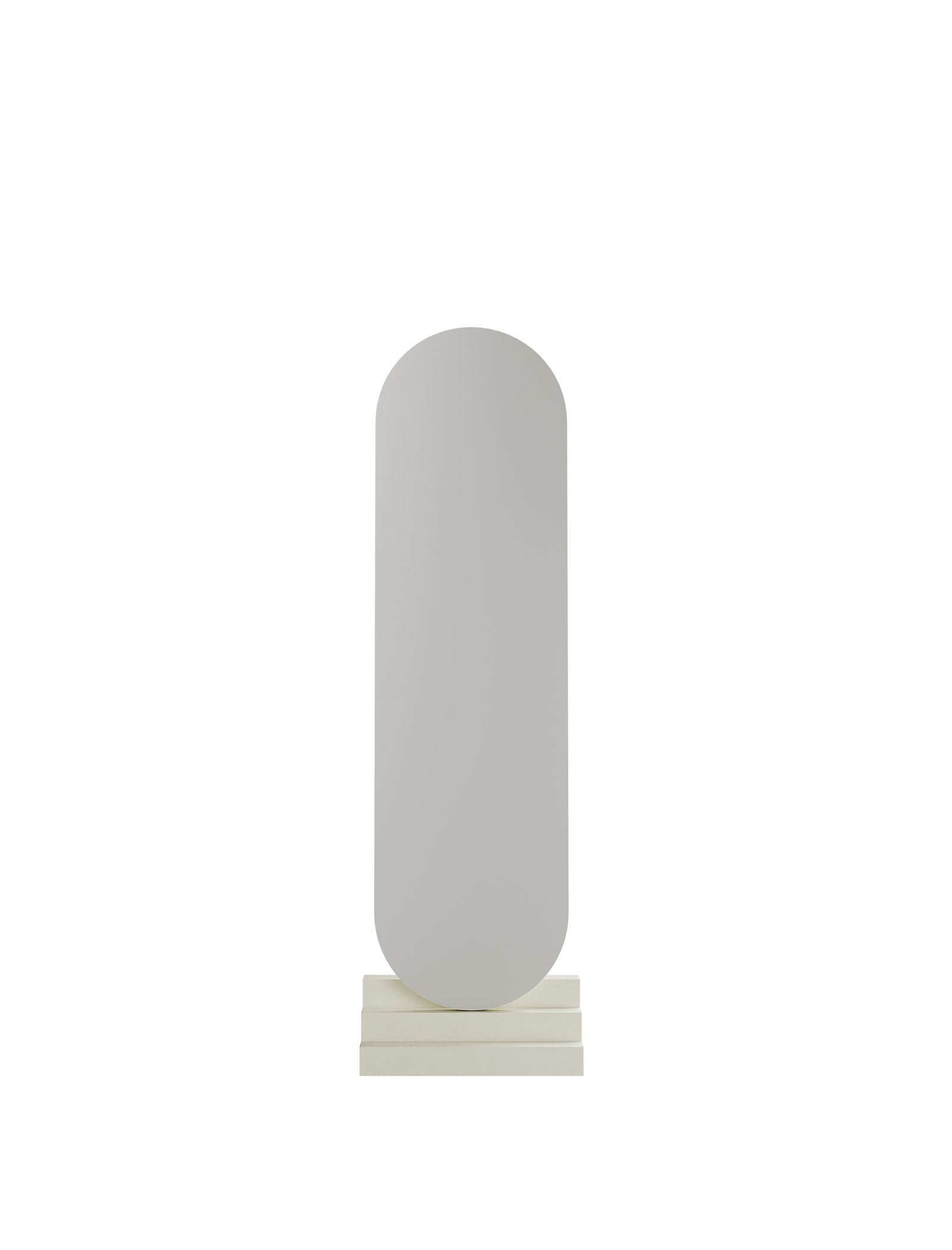NONCHALANT Mirror L with rounded top and base, designed to lean effortlessly yet securely against the wall.