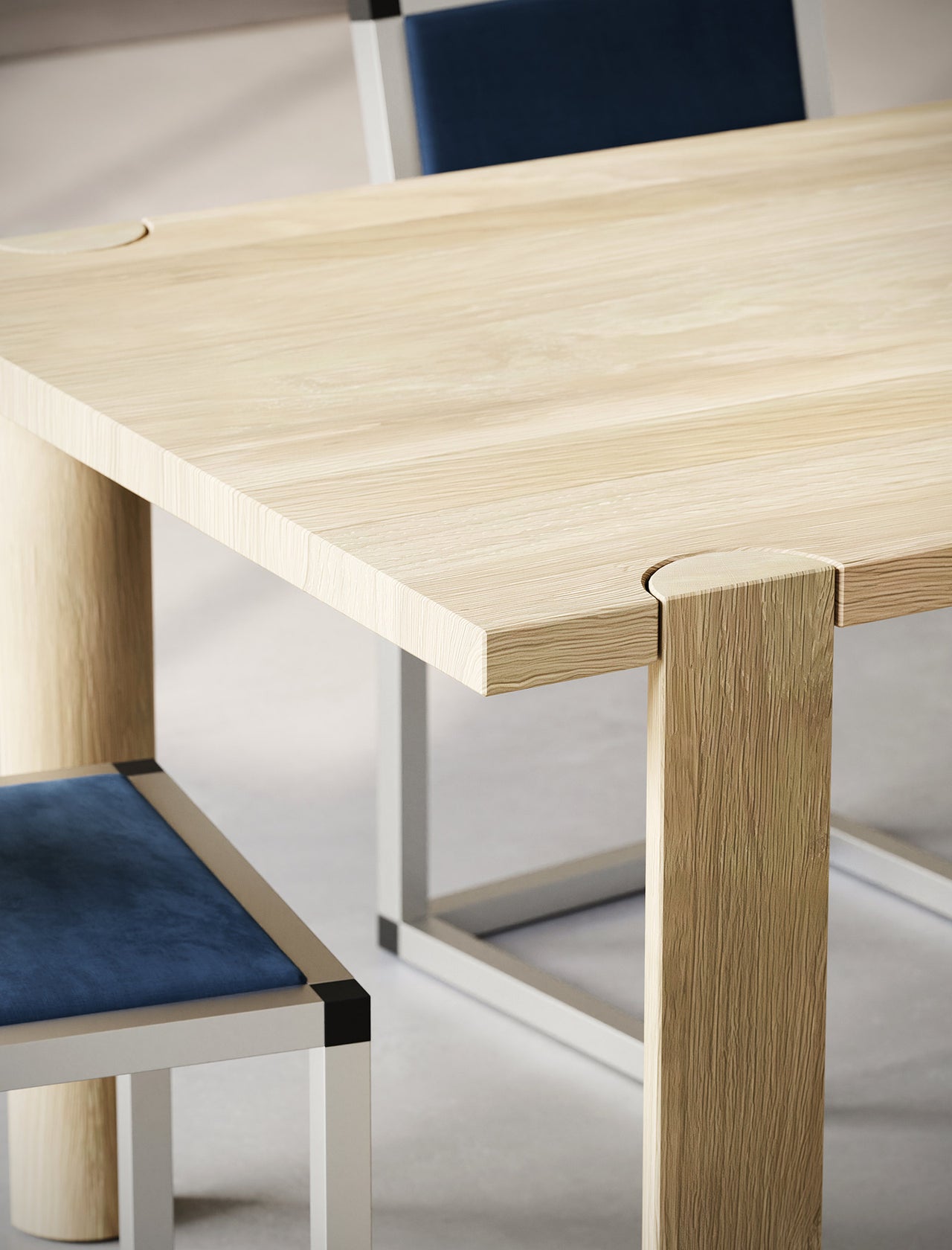 EVERYDAY Table made of solid wood with four rounded legs and a natural wood grain tabletop shown with modern chairs.