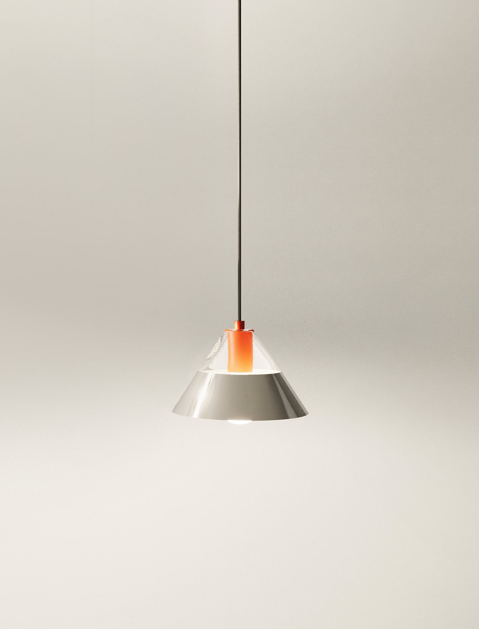 FIFTY FIFTY Lamp with glass and metal shades providing balanced warm and focused lighting in a sleek pendant design.