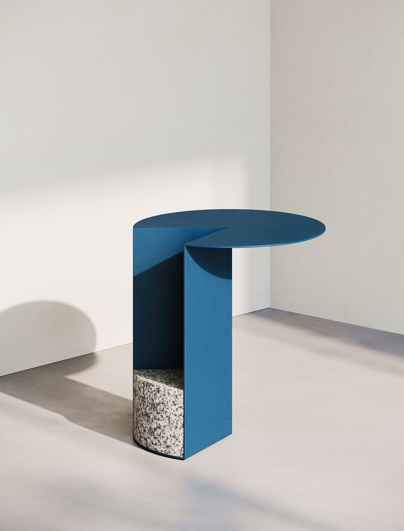 PAC Side Table - 700 with round blue aluminum top and solid granite base in minimalist setting.