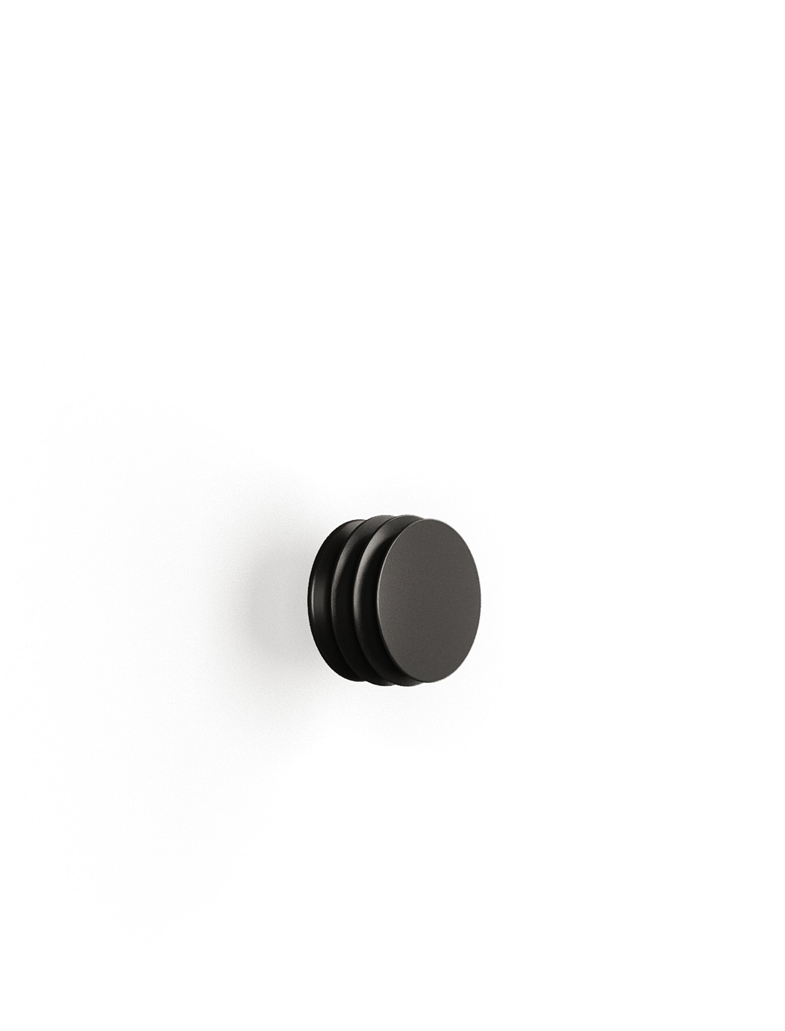 ACCORDION Hook - S1, a minimalist black wall hook with a sculptural, accordion-like design for hanging items.